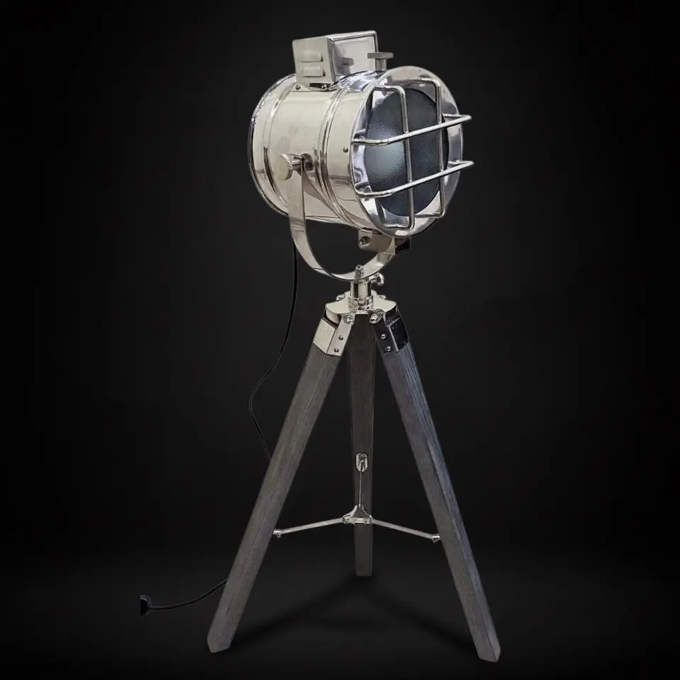 Chrome Spotlight on Grey Wooden Tripod